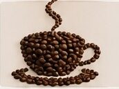 Coffee beans arranged in the shape of a cup